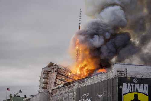 Fire rages from the dragon spire of the Stock Exchange in Copenhagen, Denmark, Tuesday, April 16, 2024. 