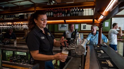 Jennifer Rounds pouring last drinks at Fortune of War, Sydney's oldest pub prior to closing its doors on March 23.
