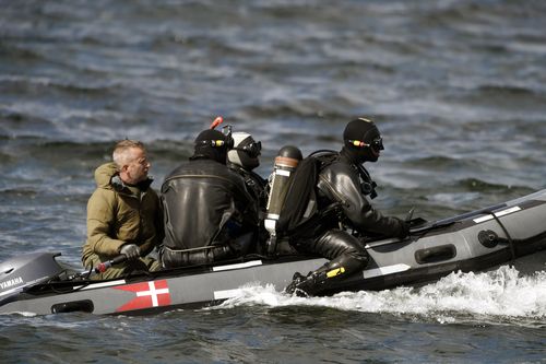 Divers from the Danish Defence Command is preparing for a dive in Koge Bugt near Amager in Copenhagen. (AAP)