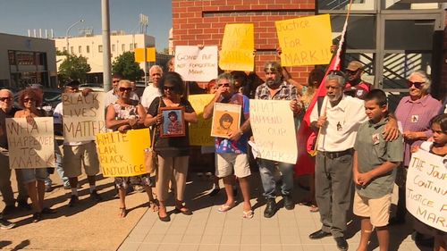 Family and friends stood outside Tamworth Police Station, calling on people with information to come forward. (9NEWS)