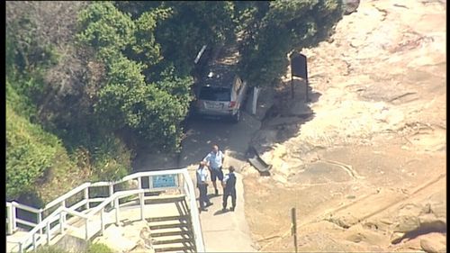 The female driver aged in her 70s reversed the car down the cliff at Malabar in Sydney's south-east. (9NEWS)