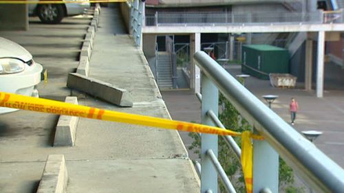 A displaced concrete divider and the broken barrier where Thomas Lee crashed to his death. (9NEWS)