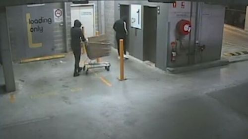 Three men caught on CCTV stealing a safe filled with jewellery from a store in Ultimo, Sydney.