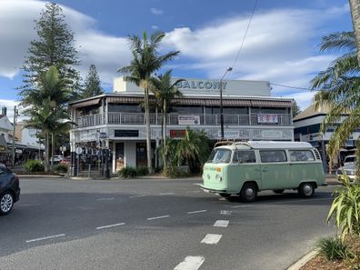 Old VW kombi campervan (1974) driving in Byron Bay, Australia, on a winter day in August. In front of The Balcony.