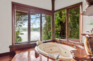 "World-class resort property" called Secrets on the Lake is on offer, and features 10 cabins with sunken spas, all set amongst pristine rainforest.