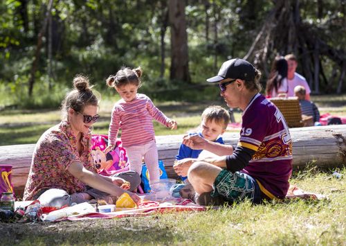 A family enjoys a picnic at Daisy Hill Forest Park in Brisbane, Saturday, May 2, 2020. 