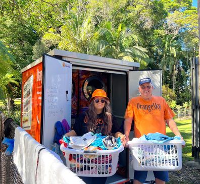 Two OrangeSky volunteers doing washing.