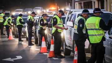 Police stop and question drivers at a checkpoint on July 8, 2020 in Albury, Australia.
