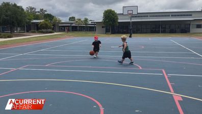 Floyd Morley and a friend playing basketball.