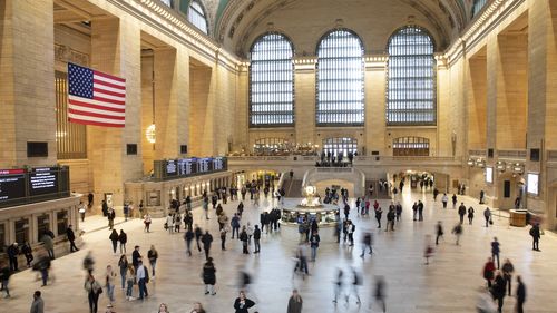 Commuters pass through a quiet Grand Central Terminal, Tuesday, March 10, 2020 in New York. 