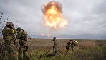 Ukrainian soldiers fire at Russian positions 