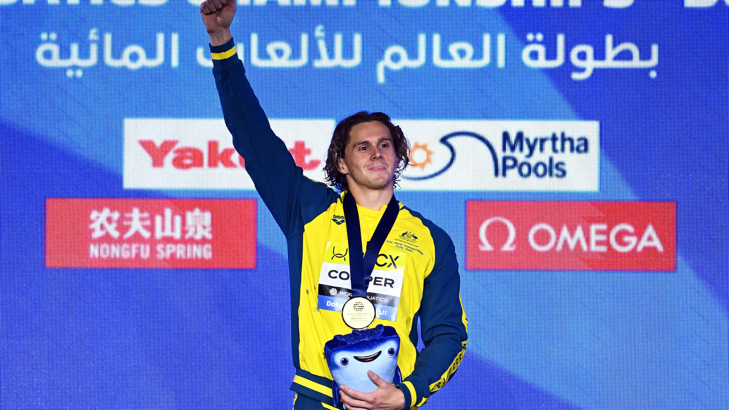 Isaac Cooper celebrates his World Aquatics Championships gold medal.