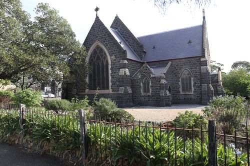 Streets surrounding St Mary's Anglican Church in North Melbourne were placed in lockdown as armed officers stormed the location arresting two people. 