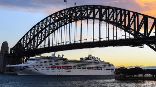 P&O Cruises Australia's flagship Pacific Explorer passes under the Harbour Bridge on its first guest cruise following the restart of cruising in Australia on May 31, 2022.