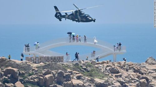 Chinese military helicopters fly past Pingtan island, one of mainland China's closest point from Taiwan on August 4, 2022.