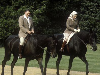 Queen Elizabeth II, Ronald Reagan, President of the USA, Queen Elizabeth II riding in the grounds of Windsor Castle with US President Ronald Reagan, during his state visit to the UK, 8th June 1982. She is riding her horse ëBurmeseí and he is mounted on 'Centennial', both gifts to the Queen from the Canadian Mounted Police, 8th June 1982. (Photo by John Shelley Collection/Avalon/Getty Images)