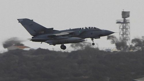 A British jet returns to base on Cyprus after a scouting run over ISIL territory. (AAP)