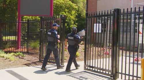 More than a dozen students at an Adelaide high school have been suspended after organising and filming a brawl at lunchtime.