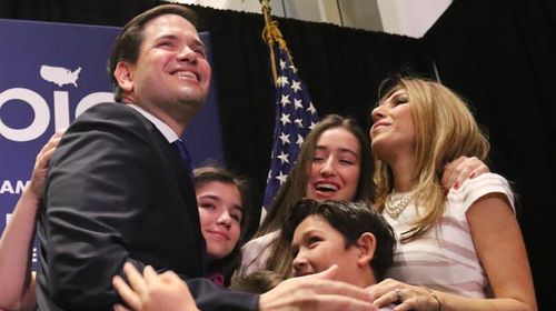 Marco Rubio with his wife and children yesterday as he announced his candidacy was over after losing his home state of Florida. (AFP/Getty)
