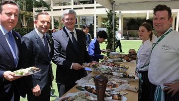 David Cameron, Tony Abbott and Stephen Harper enjoy the buffet at the G20 Leaders' Retreat. (9NEWS)