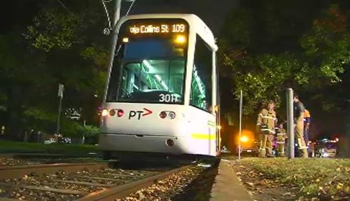 The front of the tram rolled over the woman but she was not actually hit. (9NEWS)