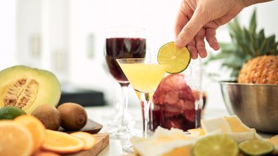 A person having a cocktail party at home