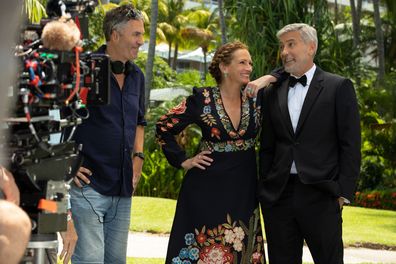 (from left) Director Ol Parker, Julia Roberts and George Clooney on the set of Ticket to Paradise.