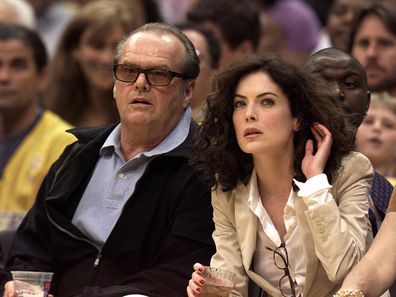 Actors Jack Nicholson and Lara Flynn Boyle watch Game 3 of the NBA Western Conference Finals between the San Antonio Spurs and the Los Angeles Lakers, courtside at the Staples Center, Los Angeles, California, May 25, 2001. (Photo by Getty Images)