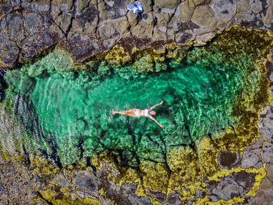 Woman in a Shoalhaven rock pool on NSW's south coast