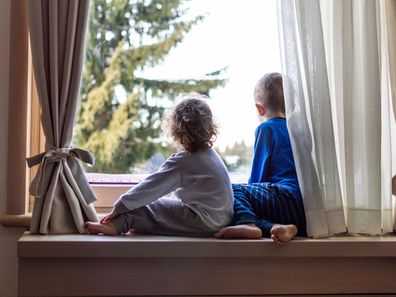 Two children at window