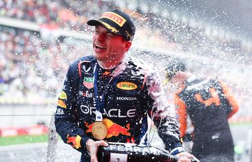 Race winner Max Verstappen celebrates on the podium after the Chinese Grand Prix.