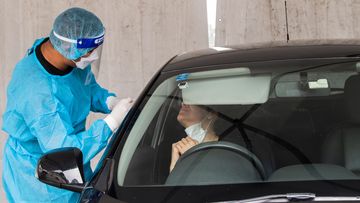A man is tested at a Histopath COVID-19 drive through clinic in Maroubra, Sydney