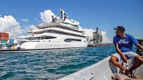 Boat captain Emosi Dawai looks at the superyacht Amadea where it is docked at the Queens Wharf in Lautoka, Fiji, on April 13, 2022. 