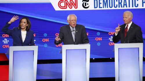 Kamala Harris, Bernie Sanders and Joe Biden all vie for attention in the Democratic debate.