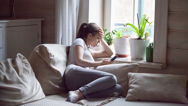 Woman sitting on couch