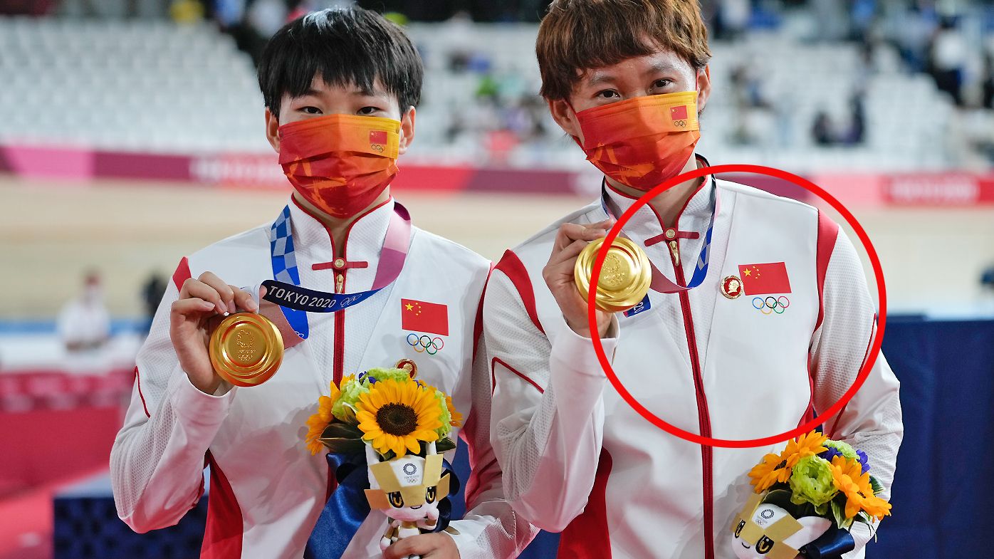 Gold medalists Zhong Tianshi and Bao Shanju of Team China wearing a Mao Tse Tung badge