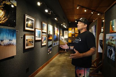 Clark Little, a wave photographer from the North Shore of Oahu, speaks during an interview at his gallery in Haleiwa, Hawaii, Friday, May 13, 2022.