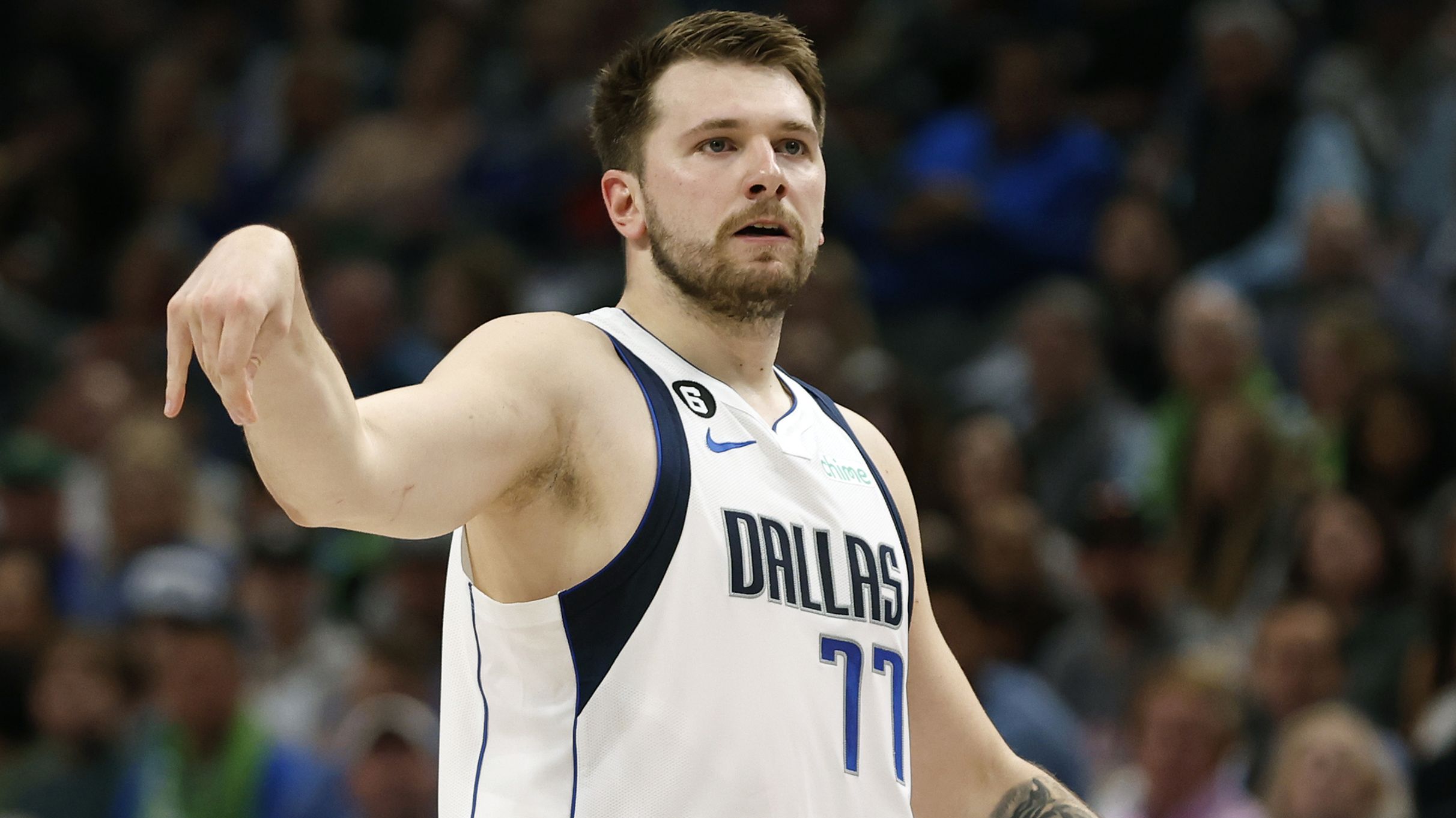 DALLAS, TEXAS - APRIL 07: Luka Doncic #77 of the Dallas Mavericks watches a shot in the first half against the Chicago Bulls at American Airlines Center on April 07, 2023 in Dallas, Texas. NOTE TO USER: User expressly acknowledges and agrees that, by downloading and or using this photograph, User is consenting to the terms and conditions of the Getty Images License Agreement. (Photo by Tim Heitman/Getty Images)