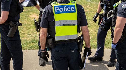 Victoria Police patrol at St Kilda beach.