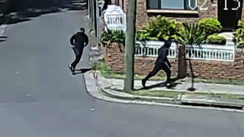 Two men were captured on CCTV running through a nearby street. (NSW Police)