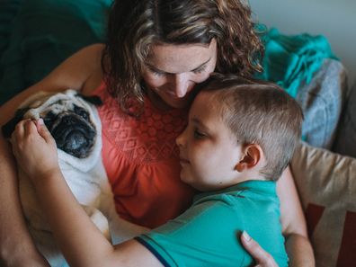 Joshua, mum Carien and dog Mango.