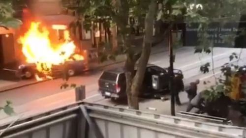 The car erupted in flames shortly before the man continued attack on police.