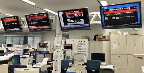 TV monitors show the J-Alert (warning siren) at an office of Kyodo News in Tokyo. (AP)