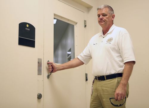 County Judge Mark Henry looks down before giving Dimitrious Pagourtzis his arraignment. (AAP)