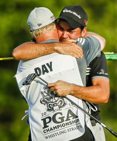 Caddie Colin Swatton was the first to embrace him.