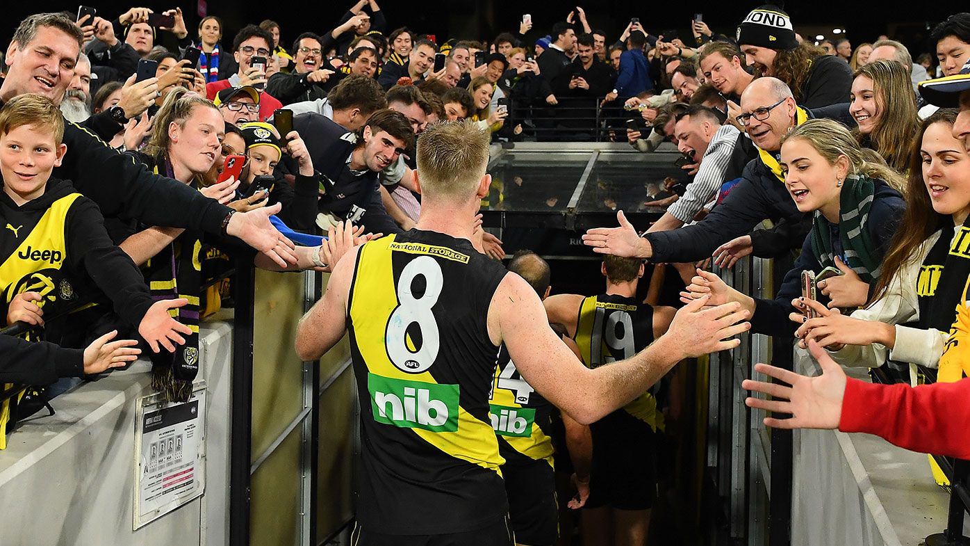 Jack Riewoldt of the Tigers high fives fans after winning the round seven AFL match between the Richmond Tigers and the Western Bulldogs at Melbourne Cricket Ground on April 30, 2021 in Melbourne, Australia. (Photo by Quinn Rooney/Getty Images)
