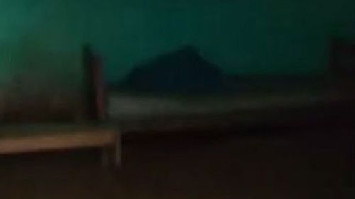 The dark bedroom where Armando Bezerra de Andrade was reportedly kept for 20 years. (Guarulhos Police)
