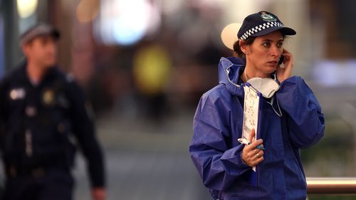 A forensic police officer at the crime scene after Kazem Mohammadi Payam allegedly fatally stabbed Nabil Naser on July 7, 2014. (AAP)