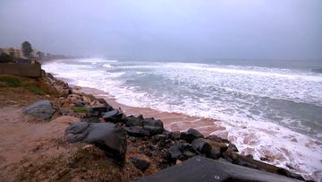More than 6000 homes and businesses were without power on the NSW South Coast, after heavy rain, strong winds and large surf pounded coastal areas.