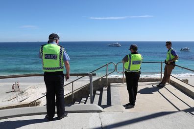 Police officers patrol Cottesloe Beach on April 10, 2020 in Perth, Australia.